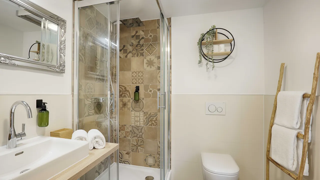 The spacious bathroom has everything you need for a comfortable stay. 